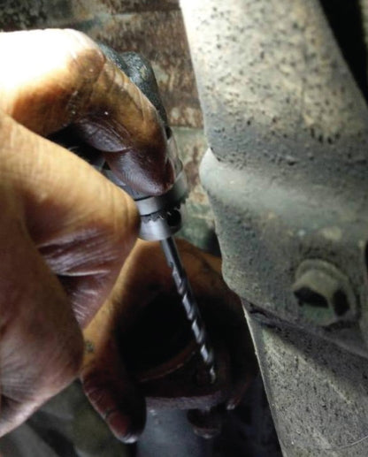 a man is working on a piece of metal